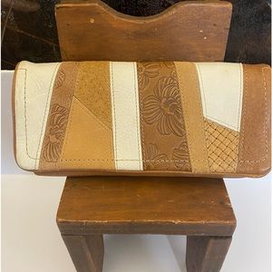 Fossil patchwork and tooled leather wallet